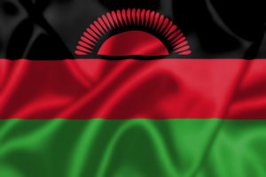 Malawi flag blowing in the wind Malawi flag blowing in the wind. Background texture.